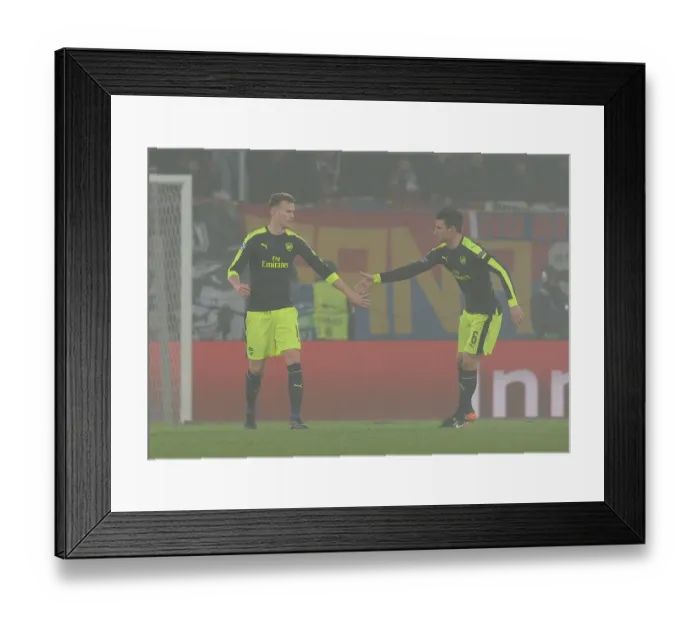 Framed Print : Arsenal's Holding and Koscielny Face Off Against FC Basel in 2016-17 Champions League