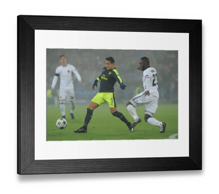 Framed Print : Arsenal's Alexis Sanchez vs. Basel's Eder Balanta: A Champions League Battle Framed Print : Arsenal's Alexis Sanchez vs. Basel's Eder Balanta: A Champions League Battle