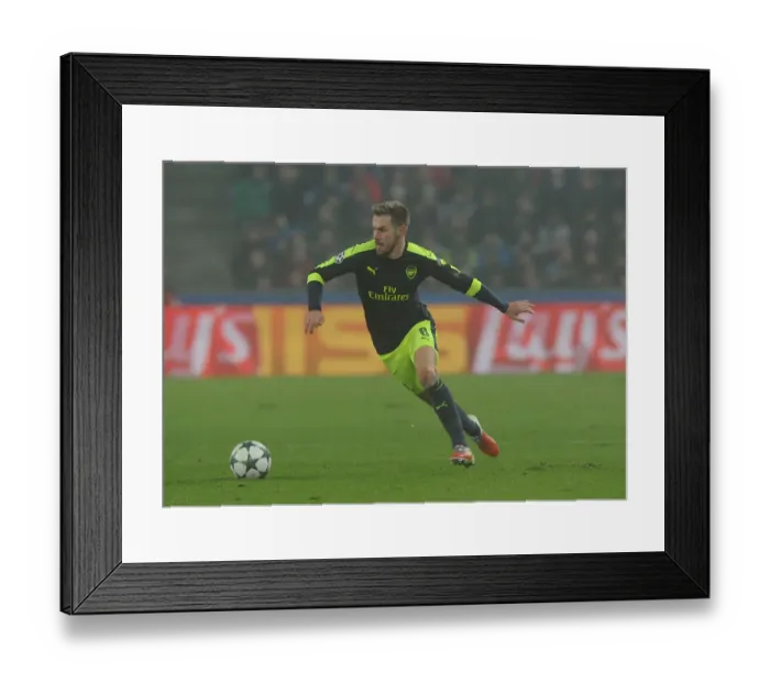 Framed Print : Arsenal's Aaron Ramsey in Action against FC Basel in 2016-17 UEFA Champions League Framed Print : Arsenal's Aaron Ramsey in Action against FC Basel in 2016-17 UEFA Champions League