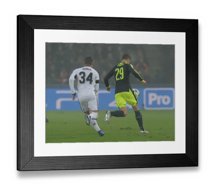 Framed Print : Granit Xhaka vs. Taulant Xhaka: Clash of the Siblings in FC Basel vs. Arsenal UEFA Champions League Match, 2016 Framed Print : Granit Xhaka vs. Taulant Xhaka: Clash of the Siblings in FC Basel vs. Arsenal UEFA Champions League Match, 2016