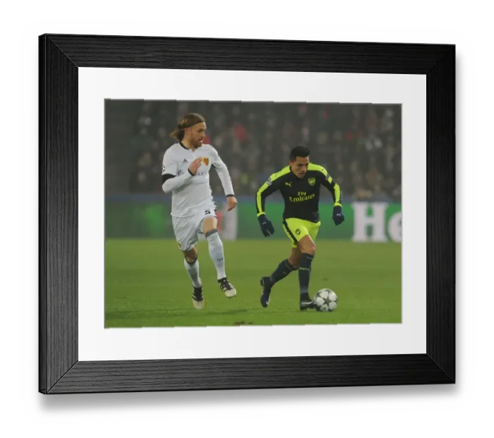 Framed Print : Alexis Sanchez vs Michael Lang: A Football Battle in the 2016-17 UEFA Champions League: FC Basel vs Arsenal