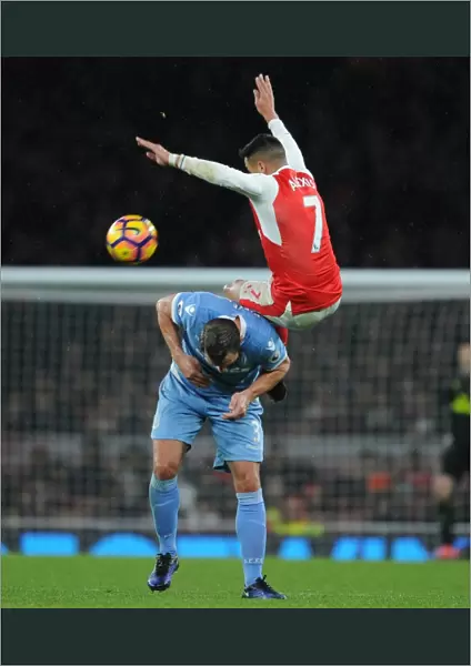 Arsenal's Alexis Sanchez Soars Above Stoke's Erik Pieters in Premier League Clash