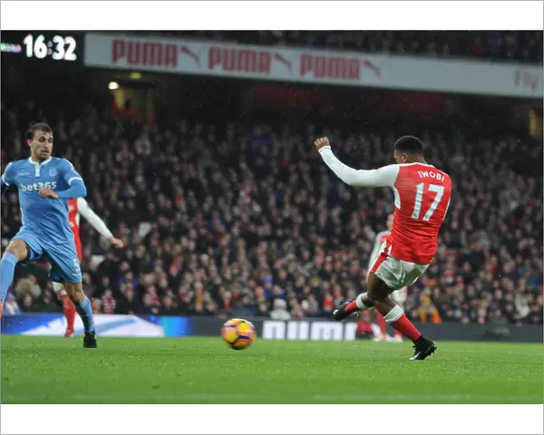 Alex Iwobi Scores His Third Goal: Arsenal's Triumph Over Stoke City in the Premier League, December 2016