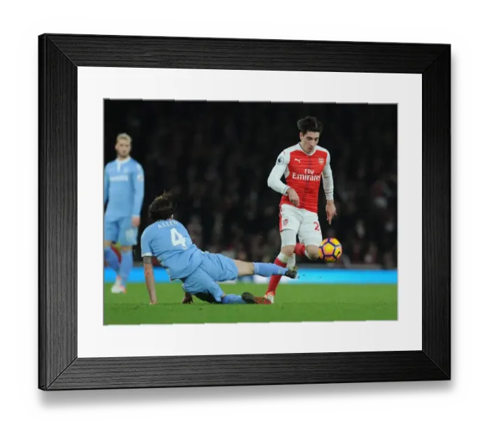 Framed Print : Arsenal's Hector Bellerin Faces Off Against Stoke City's Joe Allen in Premier League Clash
