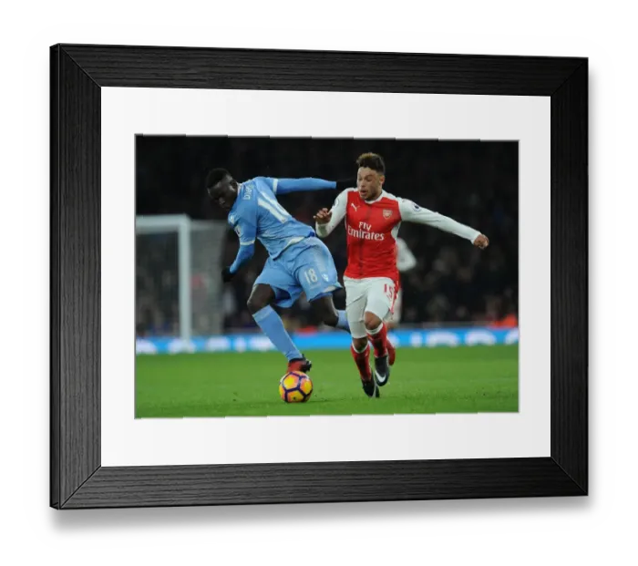 Framed Print : Intense Face-Off: Oxlade-Chamberlain vs. Diouf in Arsenal vs. Stoke Premier League Clash Framed Print : Intense Face-Off: Oxlade-Chamberlain vs. Diouf in Arsenal vs. Stoke Premier League Clash