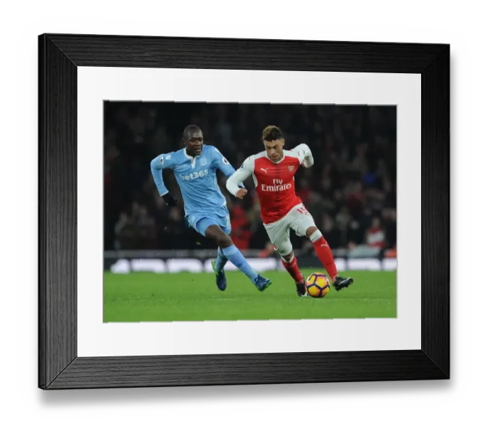 Framed Print : Intense Showdown: Oxlade-Chamberlain vs. Imbula in Arsenal vs. Stoke Football Clash Framed Print : Intense Showdown: Oxlade-Chamberlain vs. Imbula in Arsenal vs. Stoke Football Clash