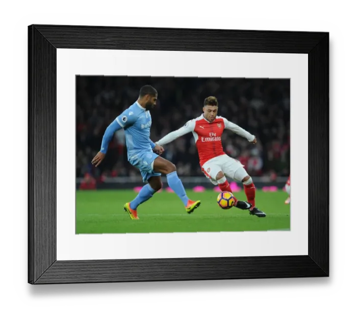Framed Print : Alex Oxlade-Chamberlain Outmaneuvers Glen Johnson in Arsenal's Victory over Stoke City Framed Print : Alex Oxlade-Chamberlain Outmaneuvers Glen Johnson in Arsenal's Victory over Stoke City