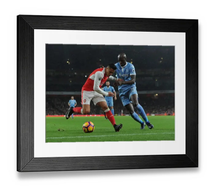Framed Print : Clash of Stars: Sanchez vs. Martins Indi - Arsenal vs. Stoke City, Premier League Framed Print : Clash of Stars: Sanchez vs. Martins Indi - Arsenal vs. Stoke City, Premier League