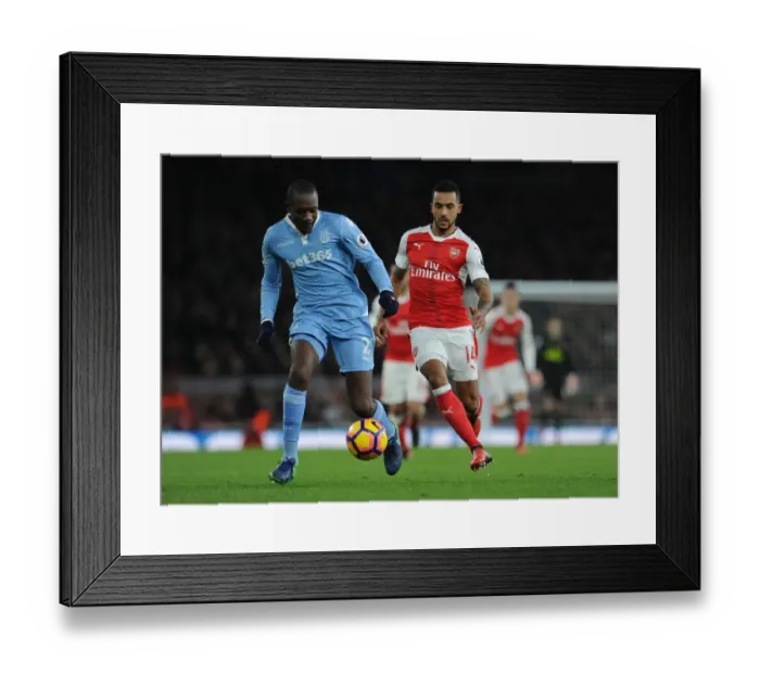 Framed Print : Theo Walcott Closes In on Giannelli Imbula: Intense Moment from Arsenal vs Stoke City, Premier League 2016-17 Framed Print : Theo Walcott Closes In on Giannelli Imbula: Intense Moment from Arsenal vs Stoke City, Premier League 2016-17