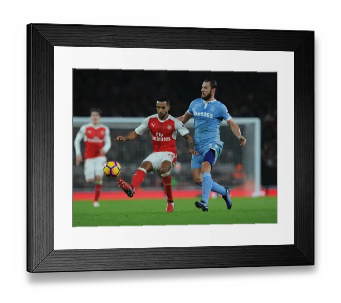 Framed Print : Theo Walcott vs Erik Pieters: Intense Battle at Arsenal's Emirates Stadium (Arsenal v Stoke City 2016-17) Framed Print : Theo Walcott vs Erik Pieters: Intense Battle at Arsenal's Emirates Stadium (Arsenal v Stoke City 2016-17)