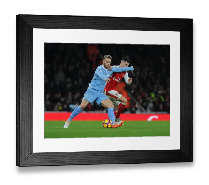 Framed Print : Xhaka vs Arnautovic: Battle for the Ball at Arsenal vs Stoke City (2016-17)