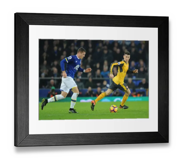 Framed Print : Clash at Goodison Park: Koscielny vs. Barkley in the Premier League Battle between Everton and Arsenal Framed Print : Clash at Goodison Park: Koscielny vs. Barkley in the Premier League Battle between Everton and Arsenal