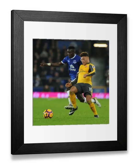 Framed Print : Oxlade-Chamberlain vs. Gueye: Intense Battle at Goodison Park - Premier League Showdown Framed Print : Oxlade-Chamberlain vs. Gueye: Intense Battle at Goodison Park - Premier League Showdown