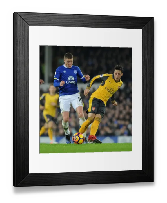 Framed Print : Mesut Ozil vs James McCarthy: Intense Battle at Goodison Park - Everton vs Arsenal, Premier League 2016-17