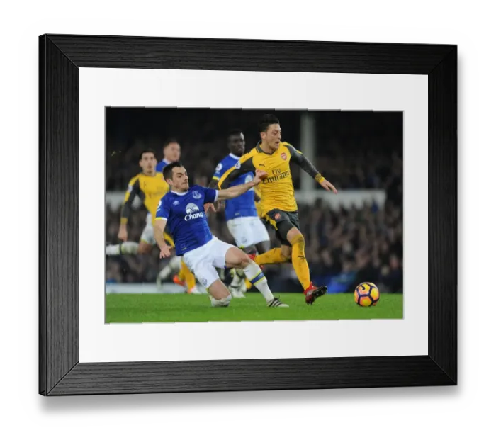 Framed Print : Mesut Ozil vs Leighton Baines: Intense Battle at Goodison Park - Everton vs Arsenal, Premier League 2016-17 Framed Print : Mesut Ozil vs Leighton Baines: Intense Battle at Goodison Park - Everton vs Arsenal, Premier League 2016-17