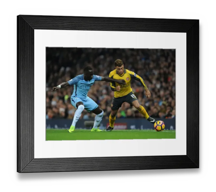 Framed Print : Arsenal's Oxlade-Chamberlain Faces Off Against Man City's Sagna in Premier League Clash (2016-17)