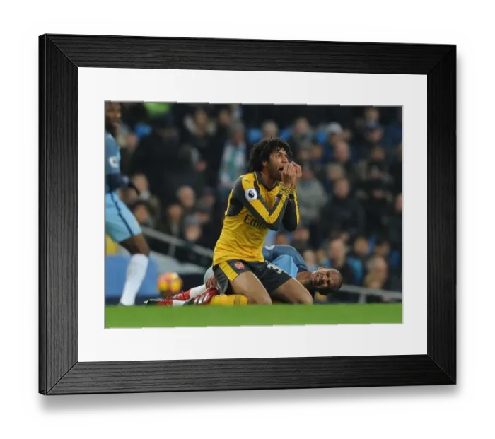 Framed Print : Mohamed Elneny of Arsenal Faces Off Against Manchester City in Premier League Clash (2016-17)