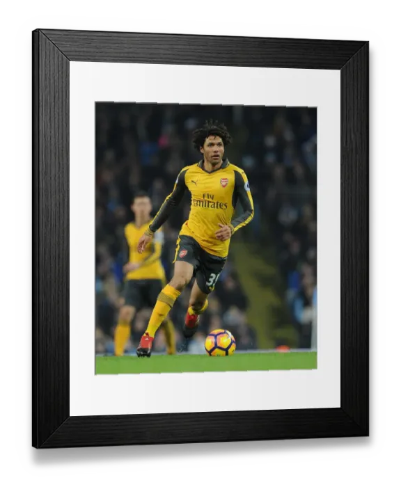 Framed Print : Mohamed Elneny (Arsenal). Manchester City 2: 1 Arsenal. Premier League. Eithad Stadium Framed Print : Mohamed Elneny (Arsenal). Manchester City 2: 1 Arsenal. Premier League. Eithad Stadium