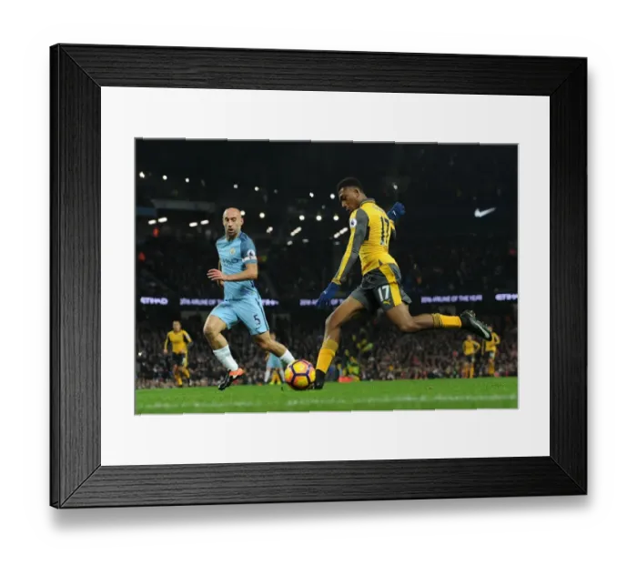 Framed Print : Arsenal's Alex Iwobi Faces Off Against Manchester City's Pablo Zabaleta in Premier League Showdown