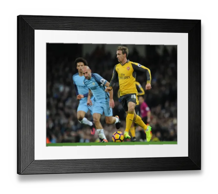 Framed Print : Nacho Monreal (Arsenal). Manchester City 2: 1 Arsenal. Premier League. Eithad Stadium Framed Print : Nacho Monreal (Arsenal). Manchester City 2: 1 Arsenal. Premier League. Eithad Stadium