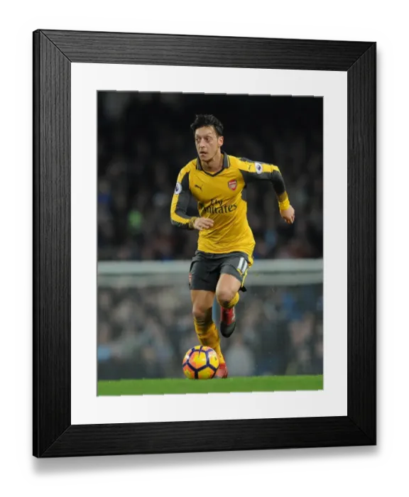 Framed Print : Mesut Ozil (Arsenal). Manchester City 2: 1 Arsenal. Premier League. Eithad Stadium