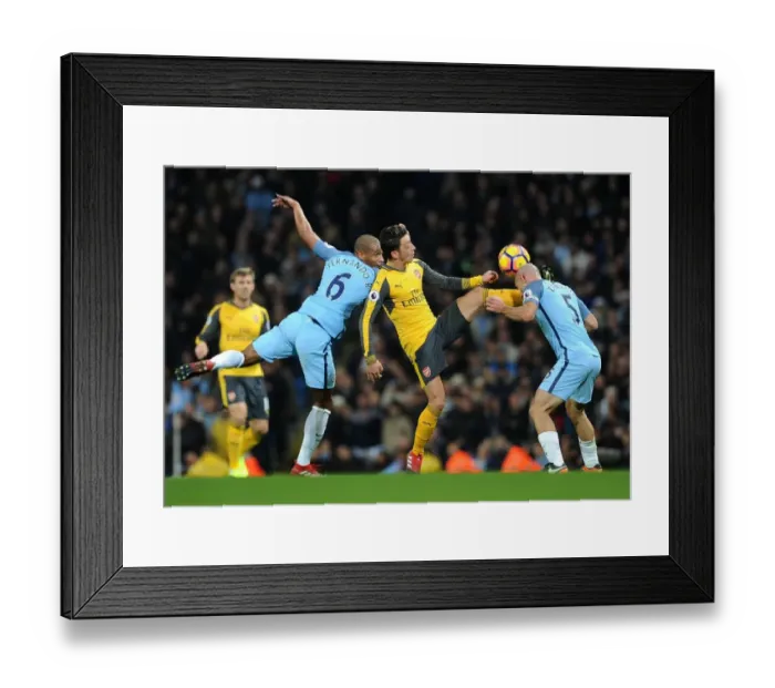 Framed Print : Mesut Ozil Faces Off Against Pablo Zabaleta and Fernando Reges in Manchester City vs Arsenal Clash