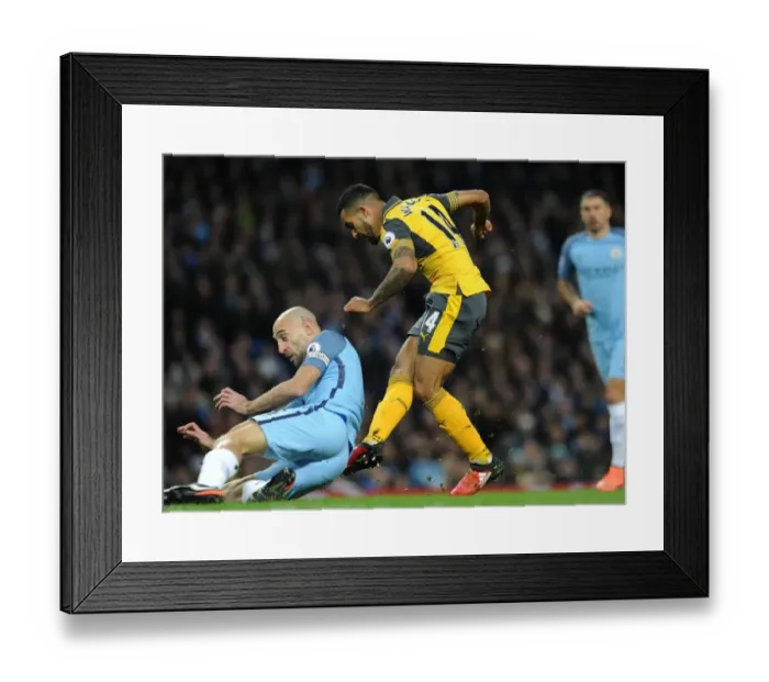 Framed Print : Theo Walcott Scores Dramatic Goal Against Manchester City's Pablo Zabaleta (Premier League 2016-17) Framed Print : Theo Walcott Scores Dramatic Goal Against Manchester City's Pablo Zabaleta (Premier League 2016-17)