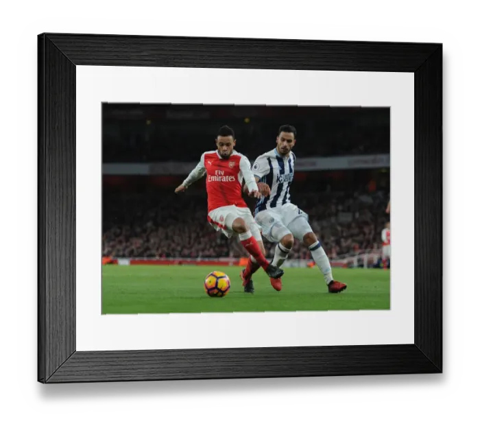 Framed Print : Arsenal's Francis Coquelin Fends Off West Brom's Nacer Chadli in Premier League Clash Framed Print : Arsenal's Francis Coquelin Fends Off West Brom's Nacer Chadli in Premier League Clash