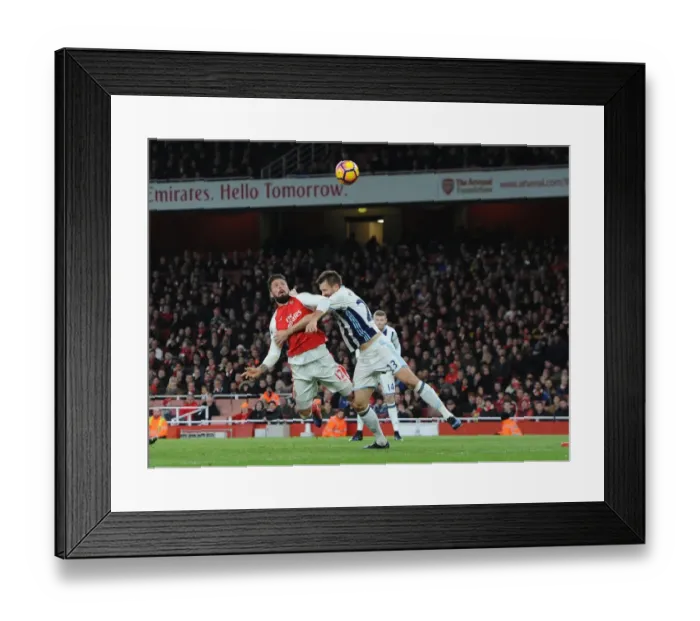 Framed Print : Olivier Giroud Scores Under Pressure Against Gareth McAuley: Arsenal vs. West Bromwich Albion, Premier League 2016-17