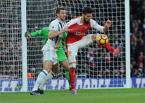 Intense Face-Off: Giroud vs. McAuley in Arsenal's Premier League Battle
