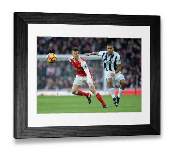 Framed Print : Koscielny's Determined Defence: Arsenal vs. West Bromwich Albion (2016-17) - Koscielny Fends Off Rondon