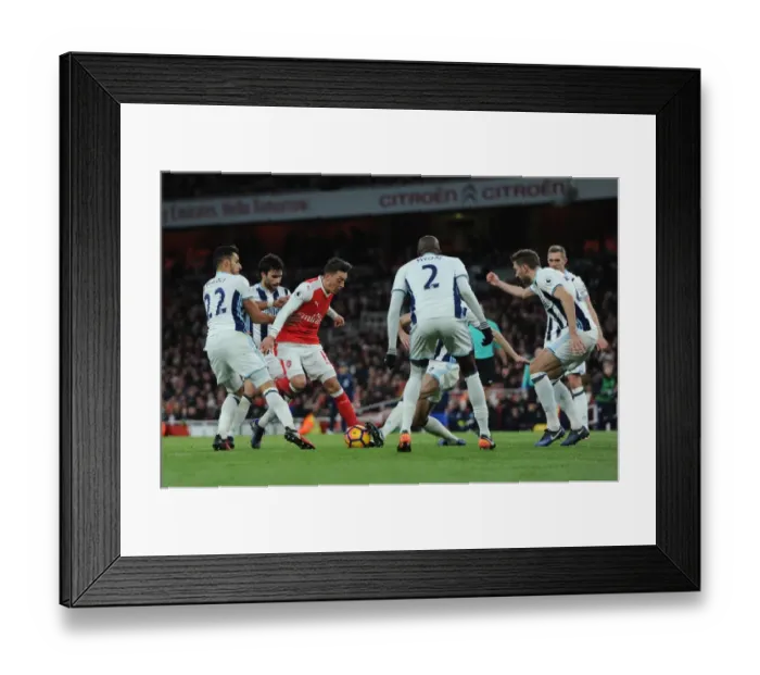 Framed Print : Mesut Ozil (Arsenal) takes on Nacer Chadli and Claudio Yacob (WBA) Framed Print : Mesut Ozil (Arsenal) takes on Nacer Chadli and Claudio Yacob (WBA)