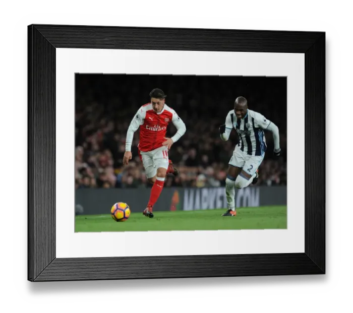 Framed Print : Mesut Ozil vs Allan Nyom: Battle in the Midfield - Arsenal vs West Bromwich Albion (2016-17)