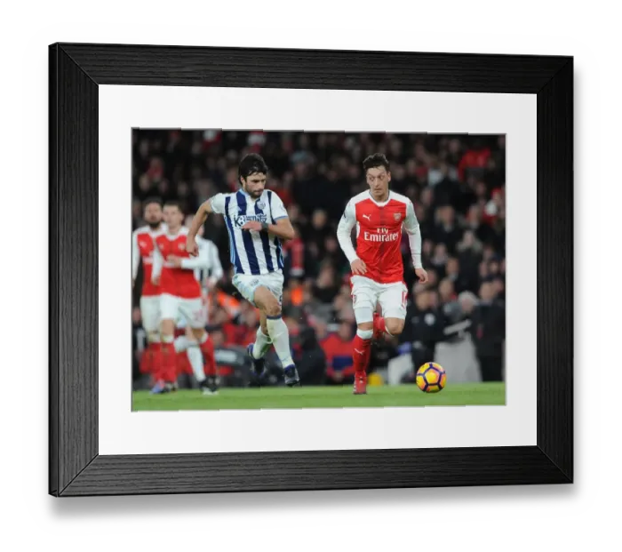 Framed Print : Mesut Ozil vs. Claudio Yacob: Battle in the Midfield - Arsenal v West Bromwich Albion, Premier League (2016-17) Framed Print : Mesut Ozil vs. Claudio Yacob: Battle in the Midfield - Arsenal v West Bromwich Albion, Premier League (2016-17)