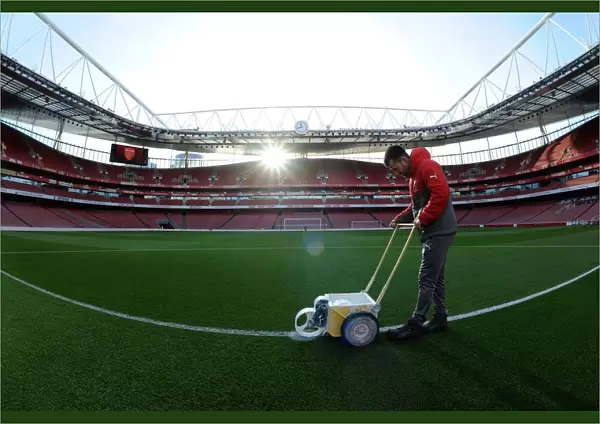 Arsenal Groundsman Prepares Emirates Stadium Pitch for Arsenal vs West Bromwich Albion (2016-17)