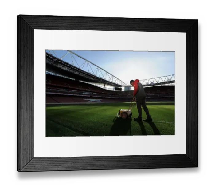 Framed Print : Arsenal Groundsman Prepares Emirates Stadium Pitch for Arsenal vs West Bromwich Albion (2016-17)