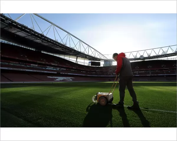 Arsenal Groundsman Prepares Emirates Stadium Pitch for Arsenal vs West Bromwich Albion (2016-17)