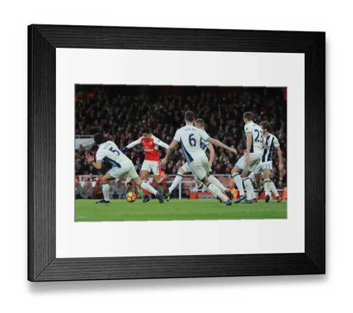 Framed Print : Arsenal's Alexis Sanchez Goes Head-to-Head with Claudio Yacob and Jonny Evans in Intense Football Battle