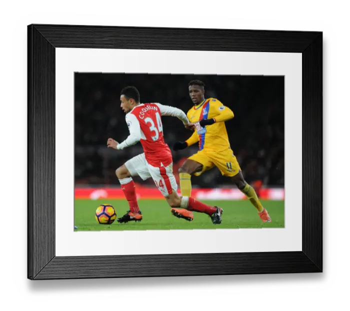 Framed Print : Arsenal vs Crystal Palace: Coquelin Clashes with Zaha in Premier League Showdown Framed Print : Arsenal vs Crystal Palace: Coquelin Clashes with Zaha in Premier League Showdown