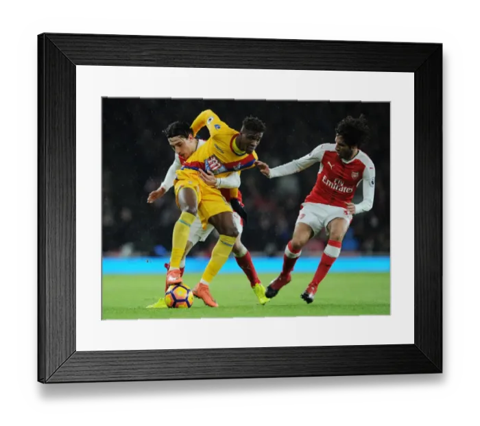 Framed Print : Arsenal vs Crystal Palace: Intense Battle Between Hector Bellerin, Mohamed Elneny, and Wilfred Zaha in the 2016-17 Premier League