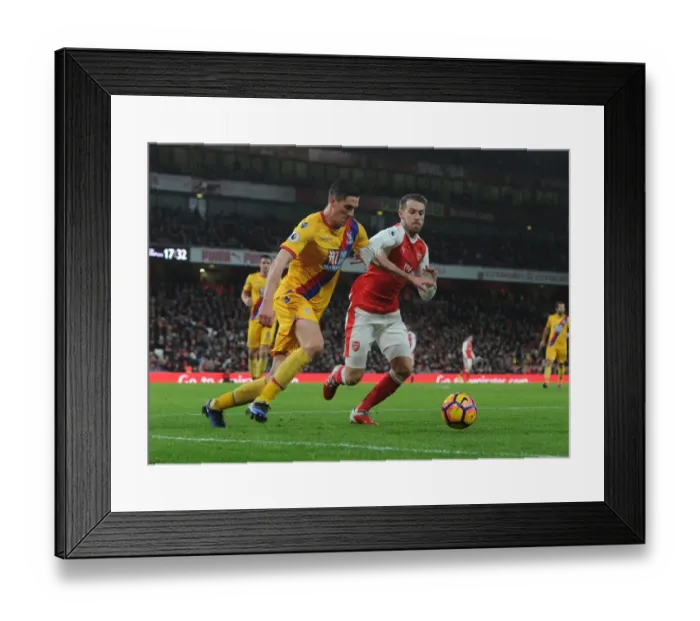 Framed Print : Arsenal vs. Crystal Palace: Ramsey Takes on Ward in Intense Premier League Clash Framed Print : Arsenal vs. Crystal Palace: Ramsey Takes on Ward in Intense Premier League Clash