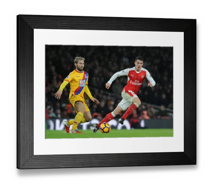 Framed Print : Arsenal vs Crystal Palace: Intense Battle between Xhaka and Cabaye in the Premier League Framed Print : Arsenal vs Crystal Palace: Intense Battle between Xhaka and Cabaye in the Premier League