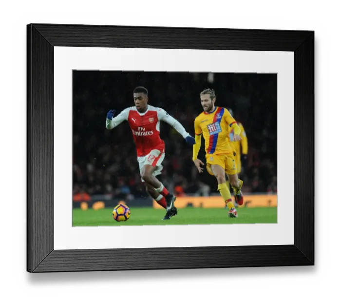 Framed Print : Arsenal's Alex Iwobi Outmaneuvers Crystal Palace's Yohan Cabaye during the 2016-17 Premier League Match Framed Print : Arsenal's Alex Iwobi Outmaneuvers Crystal Palace's Yohan Cabaye during the 2016-17 Premier League Match