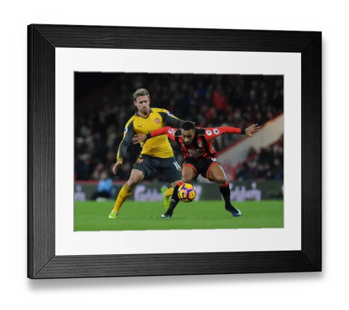 Framed Print : Nacho Monreal vs. Junior Stanislas: Intense Clash Between AFC Bournemouth and Arsenal in the Premier League Framed Print : Nacho Monreal vs. Junior Stanislas: Intense Clash Between AFC Bournemouth and Arsenal in the Premier League