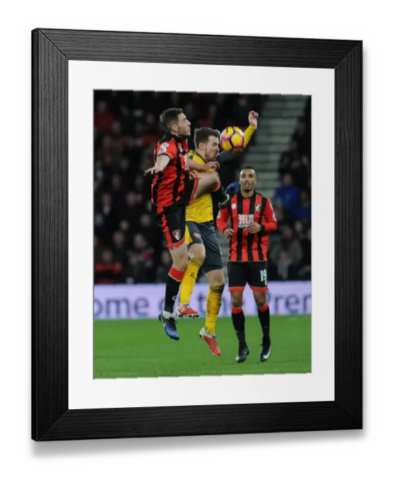 Framed Print : Aaron Ramsey vs. Dan Gosling: Intense Battle in AFC Bournemouth vs. Arsenal Premier League Clash