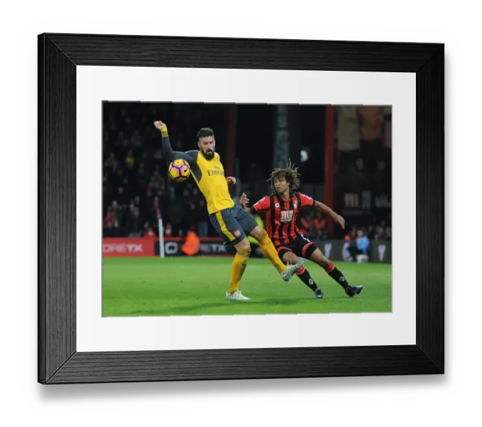 Framed Print : Arsenal's Olivier Giroud Faces Off Against Bournemouth's Nathan Ake in Intense Premier League Clash Framed Print : Arsenal's Olivier Giroud Faces Off Against Bournemouth's Nathan Ake in Intense Premier League Clash
