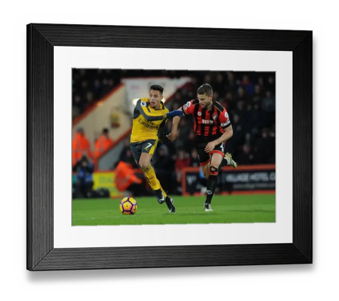 Framed Print : Arsenal's Alexis Sanchez vs. Bournemouth's Simon Francis: A Premier League Battle Framed Print : Arsenal's Alexis Sanchez vs. Bournemouth's Simon Francis: A Premier League Battle