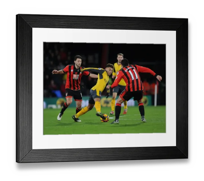 Framed Print : Arsenal's Oxlade-Chamberlain Stands Firm Against Bournemouth Duo Arter and Daniels in Intense Premier League Battle