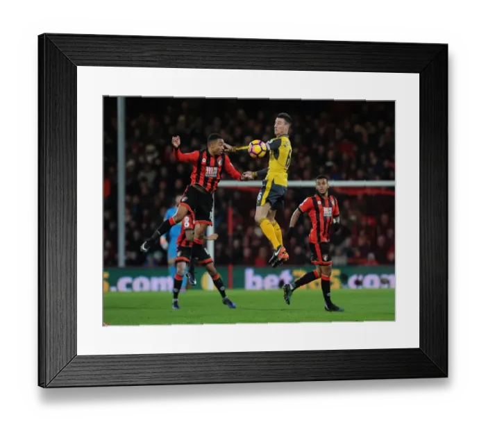 Framed Print : Arsenal's Koscielny Heads Away from Stanislas in AFC Bournemouth Clash (2016-17) Framed Print : Arsenal's Koscielny Heads Away from Stanislas in AFC Bournemouth Clash (2016-17)