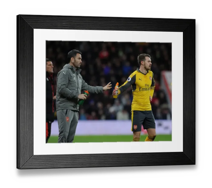 Framed Print : Arsenal's Aaron Ramsey Hydrates with Fitness Coach during AFC Bournemouth Match, 2016-17 Framed Print : Arsenal's Aaron Ramsey Hydrates with Fitness Coach during AFC Bournemouth Match, 2016-17